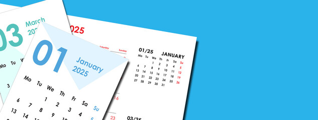 Top view of a stack of 2025 calendar cards scattered on a blue background. Banner or header with copy space.