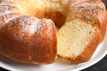 Freshly baked sponge cake on stand, closeup