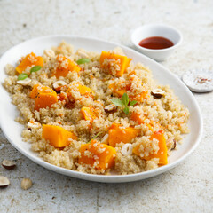 Roasted pumpkin with quinoa and hazelnut