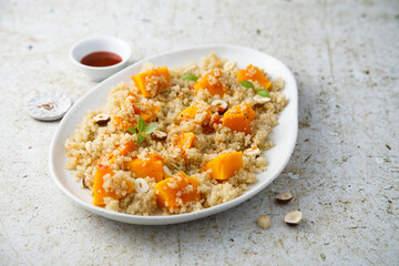 Roasted pumpkin with quinoa and hazelnut