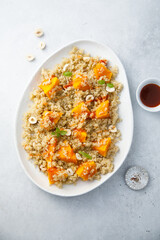 Roasted pumpkin with quinoa and hazelnut