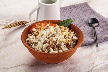 Curd with granola and orange jam