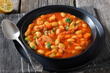 Pasulj, white bean soup with chicken in bowl