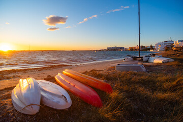 Formentera, playa de la Savina al atardecer con barcas