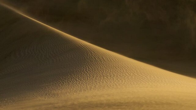 Exploring the beauty of golden sand dunes and shifting patterns at sunset. Sandstorm in the deset. Rub' al Khali, aka Empty Quarter desert, Arabian Peninsula 