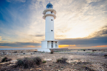 Formentera, baleares, faro Cap de Barbaria, cabo de Barbaria al atardecer  con el cielo rojo