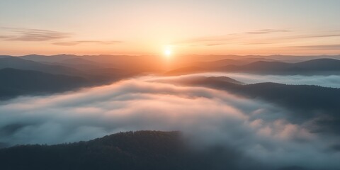 Sunrise showcasing cirrocumulus clouds above majestic mountains emerging from a blanket of mist, creating a stunning visual of the seamless beauty between cirrocumulus clouds and nature.