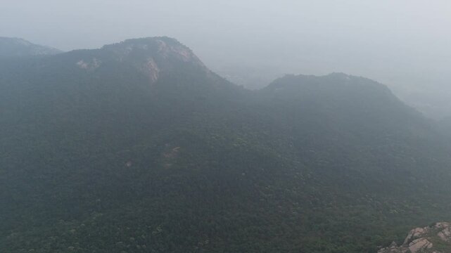  A serene aerial shot of Matha&rsquo;s hilltop, offering a peaceful, silent view of the surrounding forest.