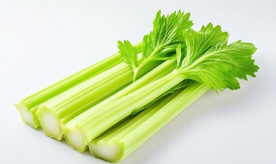Three celery stalks are sitting on a white counter