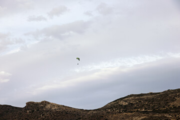 Mountain landscape with paraglider on the island of Crete in Greece in late summer