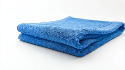 Blue beach towel displayed against a white background, showcasing its design and texture. This folded beach towel in blue is perfect for summer vacation themes and relaxing by the water.