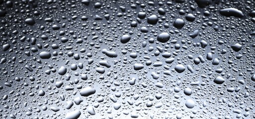 Water drops on glass surface, closeup view