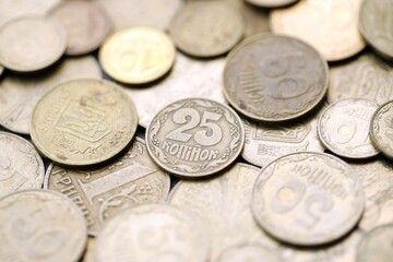 Big pile of different coins from various time period in Ukraine. Shiny Ukrainian money background