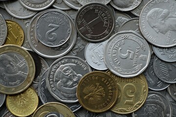 Big pile of different coins from various currencies and different countries around the world. Currency exchange