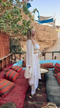 A beautiful girl in traditional clothes rests in a cafe in Egypt