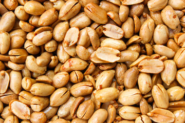 Pile of roasted salted peanut, group of nuts. Top view