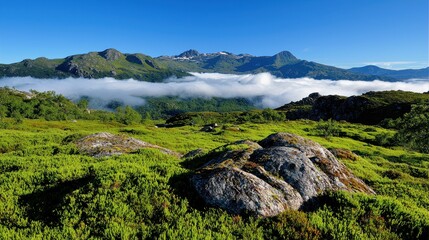 Fototapeta premium Serene Landscape of Majestic Mountains Shrouded in Soft Mist Under Clear Blue Sky