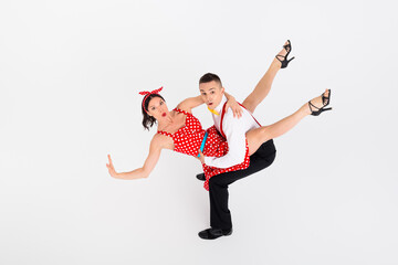 Photo of funny couple professional dancers choreographers dancing cha cha isolated on white color...