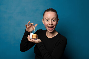 blonde young pretty woman using a facial mask