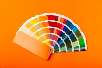 Color palette on a bright colored background. Color palette guide. paper catalog of rainbow color....