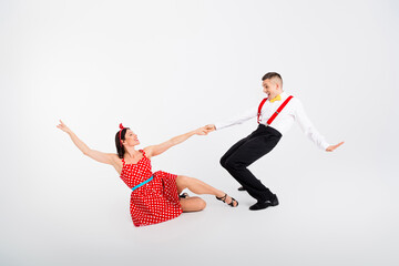 Photo of lovely attractive couple professional dancers moving in dance studio isolated on white...