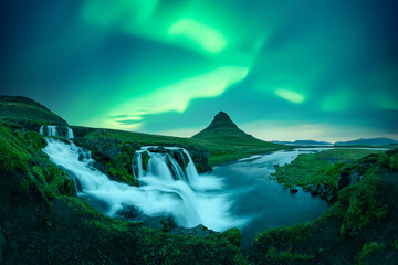 Incredible icelandic landscape with incredible sky with Northern lights over Kirkjufellsfoss...