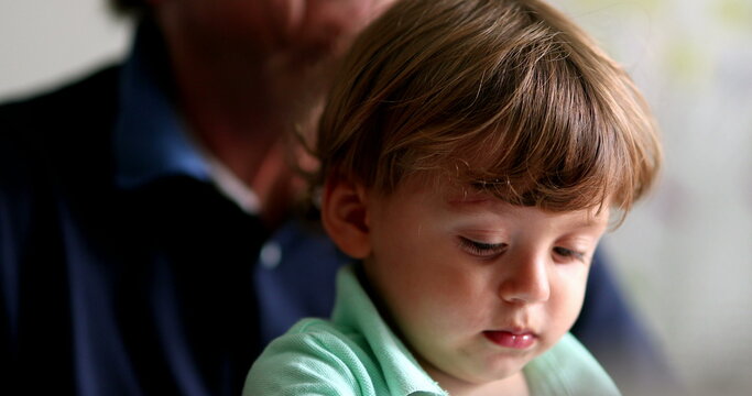 Little baby toddler on grandparent lap