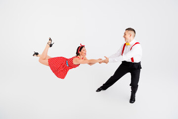 Photo of attractive active couple professional choreographers dancing dynamic rumba isolated on...