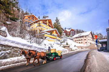 Sankt Moritz street and horse carriage scenic winter view
