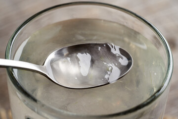 Aloe vera pulp and juice on a spoon