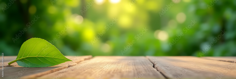 Aufkleber A real wood table top with a blurred leaf in the background amidst a garden setting is shown in sharp focus._00001_
