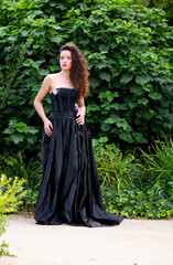 woman in elegant dress in a park