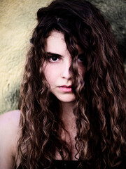 girl with long curly brown hair