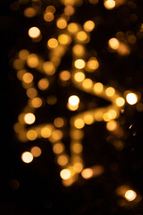 Golden Bokeh Abstract With Warm Lights and Black Background