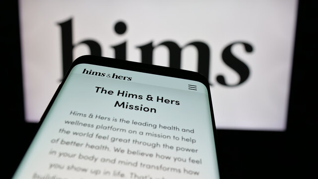 Stuttgart, Germany - 11-27-2024: Smartphone with website of US telehealth company Hims and Hers Health Inc. on screen in front of business logo. Focus on top-left of phone display.