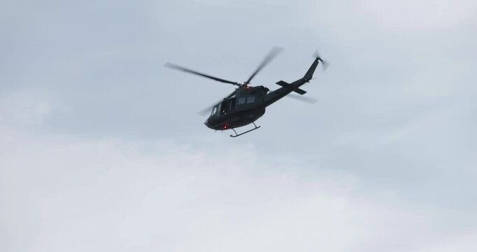 4K - American UH-1 multi-role helicopter flies away