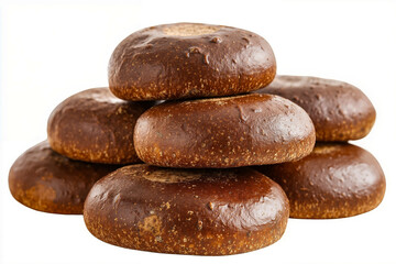 A stack of brown bread rolls sitting on top of each other