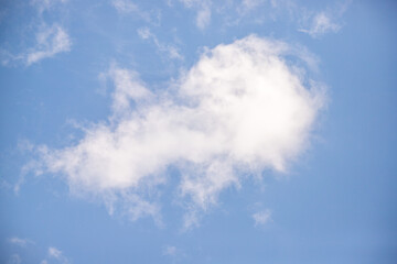 Sky background with clouds. White clouds against a blue sky.