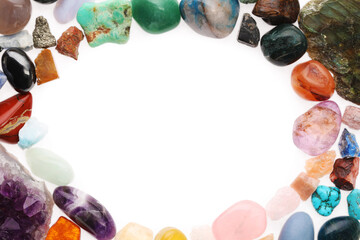 Frame of different natural mineral stones isolated on white, top view