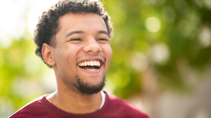 Happy man smiling in natural outdoor environment