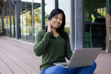 Business woman working from coffee shop using laptop online meeting in home office, Business woman typing keyboard use notebook laptop Smiling, laughing at coffee shop relaxation table.