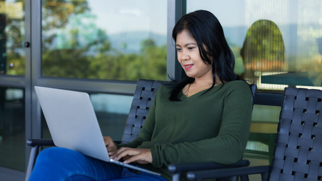 Businessman analyzing company performance graph to generate profit and growth, Businesswoman typing on laptop computer keyboard in coffee shop. Business concept. Working away from the office.