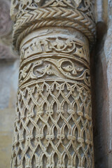 A historical building framed with artistically carved stonework. Architectural detail from the Divriği Great Mosque and Hospital, listed on the UNESCO World Heritage List. Floral and geometric motifs.