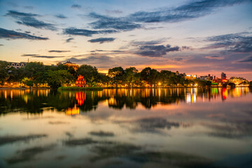 Hoan Kiem Lake ( Ho Guom) or Sword lake in the center of Hanoi in cinematic sunset sky.