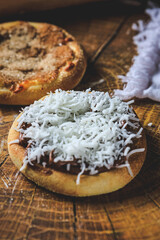 Banana esfiha or mini pizza with cinnamon and grated coconut