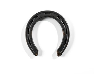 A black horseshoe rests on a clean white surface, highlighting its unique curved design and the details of its texture and finish, perfect for good luck