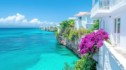 Fototapeta premium White houses on a cliff overlooking turquoise ocean.