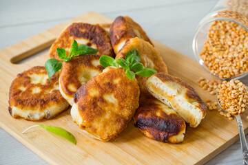 cooked fried pea pies on a wooden board