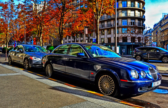 Paris, France - October 26th 2019 : Blue Jaguar s-type R and silver Jaguar XF-R of 2009 parked in George V avenue.