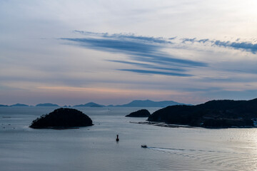 tranquil seascape of sea and islands during sunset